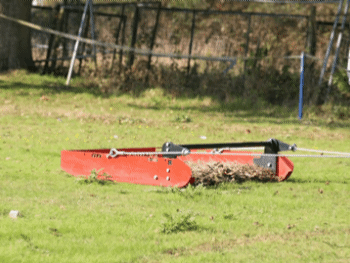 Paddock Blade being pulled across field collecting manure