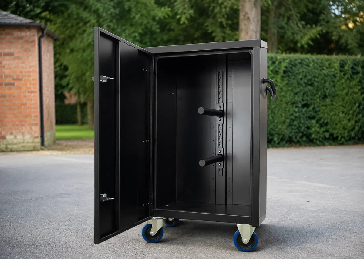 Black aluminium tack locker for horse shows with rolling wheels and saddle storage, designed for professional equestrian travel and tack room organization
