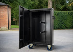 Black aluminium tack locker for horse shows with rolling wheels and saddle storage, designed for professional equestrian travel and tack room organization
