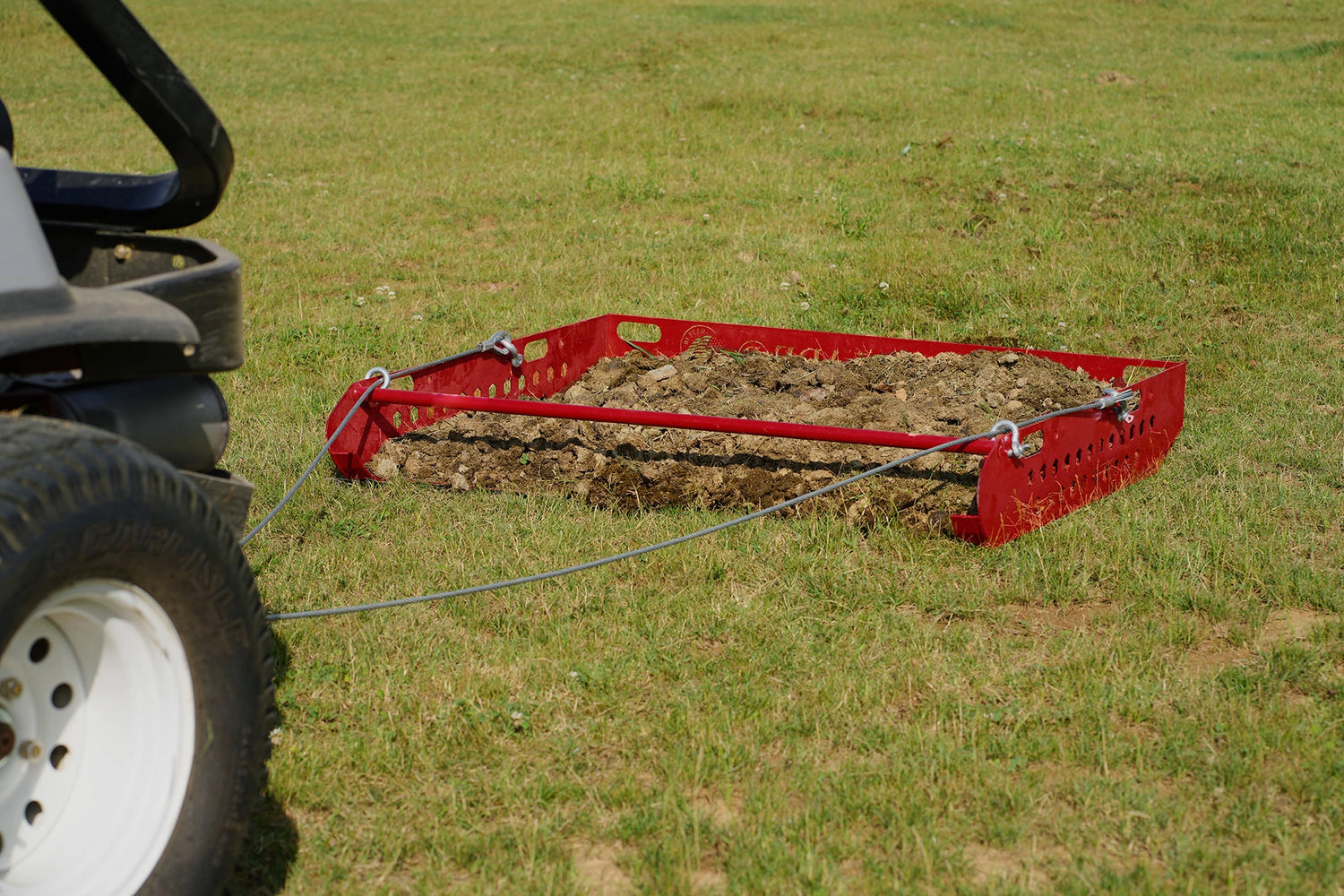 a paddock blade full of manure